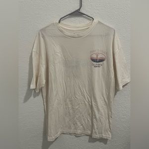 This is a small cream T- Shirt, it is a small but does run big.